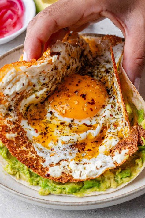 These Crispy Feta Fried Eggs will be your new obsession! With a golden feta cheesy crust and a perfectly cooked egg, it's the ultimate breakfast that'll keep you coming back for more! Calorie Guide, Crispy Feta, Fried Egg Breakfast, Fried Egg Recipes, Ultimate Breakfast, Food Carving, Fried Eggs, Breakfast Of Champions, Food Goals