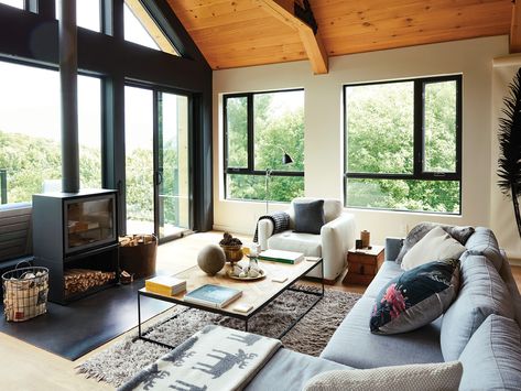 Inside a Prefab Cottage Transformed Into An Inviting Home | Chatelaine Prefab Cottages, Winter Living Room, Timber Frame Homes, Log Home, Inviting Home, Prefab Homes, A Living Room, Window Wall, Log Homes