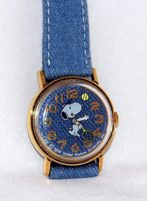 https://flic.kr/p/sh3rkf | Vintage Timex Character Watch With Snoopy Playing Tennis, Denim Dial & Original Denim Band, Manual Wind Movement, Circa 1976 | This is one of the most popular Snoopy Timex watches.  It features an animated dial with Snoopy in a tennis visor holding a tennis racket in one paw and a tennis ball circling the dial as a second hand. There are several different models with this theme. Snoopy, Snoopy Tennis, Tennis Visor, Snoopy Watch, Adam Gontier, Clock Collection, Peanuts Charlie Brown Snoopy, Wind Movement, Playing Tennis