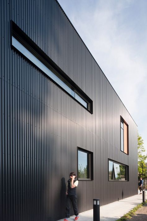 Corrugated Metal Building, Corrugated Metal Exterior, Corrugated Metal Accent Wall, Corrugated Metal Cladding, Metal Cladding House Exterior, Black Corrugated Metal, Inset Windows, Vertical Cladding, Architectural Windows