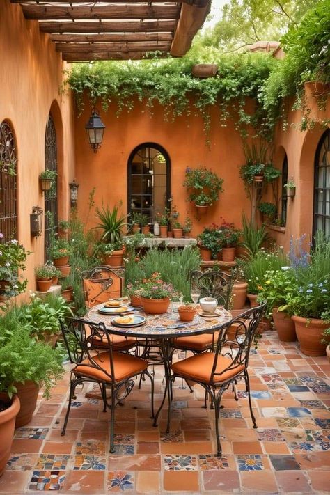 Garden Dining Table Decor, Spanish Patio Ideas Courtyards, Outdoor Spanish Patio, Tuscan Courtyard Ideas, Spanish Outdoor Patio, Spanish Courtyard Ideas, Spanish Style Patio Outdoor Spaces, Spanish Patio Ideas, Mediterranean Outdoor Patio