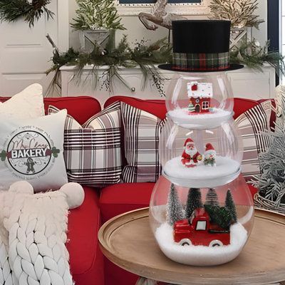 Package includes 3 fish bowls, 1 bag of fake snow, 4 Christmas trees, 1 Santa, 1 snowman, 1 red house, 1 red ceramic truck with tree, 1 black top hat. | The Holiday Aisle® Christmas Decorations Indoor - Christmas Decor - 3 Pack DIY Fish Bowl Snowman Crafts w / Fake Snow & Tree & Figures & Top Hat | Wayfair Snowman Fishbowl Christmas, Fishbowl Snowman Diy, Snowman Table Decorations, Dollar Tree Jenga Block Crafts Christmas, Diy Fish Bowl, Ceramic Truck, Fish Bowl Snowman, Bowl Snowman, Fish Bowl Decorations