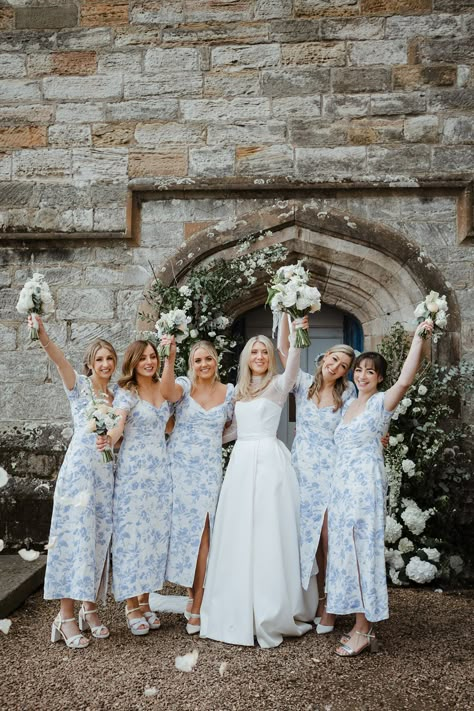 Bridesmaids in blue floral patterned bridesmaid dresses with bride in Jessica Bennett dress Something Blue Wedding Ideas, Blue Wedding Ideas, Patterned Bridesmaid, Patterned Bridesmaid Dresses, Wedding Reception Outfit, Unique Bridesmaid Dresses, Violet Wedding, Floral Bridesmaid Dresses, Bridesmaid Colors