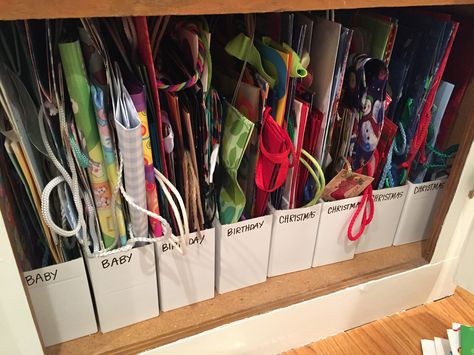 Gift bag storage using IKEA magazine holders. Gift Box Storage Ideas, Birthday Bag Storage Ideas, Christmas Gift Storage, Gift Storage Organization, Gift Bag Storage Ideas Diy, Storage Ideas For Gift Bags, Paper Napkin Storage Ideas, How To Store Gift Bags, Gift Wrapping Storage Ideas