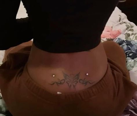 Back Tattoo With Dermal Piercing, Lower Back Percinings Dimples, Lower Back Tattoo Black Women, Sims 4 Back Dermal Piercing, Back Dermals With Tattoo, Back Demermals Piercing, Spine Piercings, Back Dermal Piercing With Tattoo, Dermal Piercing Back Dimples