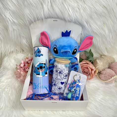 FAST SHIPPING GIFT BOX INCLUDES  * stitch plush 7.5 inch H  *20oz tumbler  *16oz glass cup  * stitch keychain make it even more special by personalizing it with the chosen name or massage in the box. The perfect gift for birthdays, holidays and more. *Note: Please understand that since all tumblers are made to order, the actual tumbler and color may vary slightly from what is shown in the photos.**  I don't own the character used in the product. All copyright and trademarks of the images used belong to their respective owners. You're paying for my time collecting, cleaning, resizing, organizing, and designing. I am NOT responsible for lost, damage or stolen packages after USPS/USP take over. WILL NOT REFUND IF USPS/UPS LOST OR DAMAGE YOUR PACKAGE! Follow me on Instagram for more pictures o Stitch Gift Basket Ideas, Stitch Birthday Basket, Stitch Gift Basket, Disney Gift Box, Disney Gift Basket For Adults, Box Stitch, Stitch Cups, Stitch Gift Ideas, Stitch Things