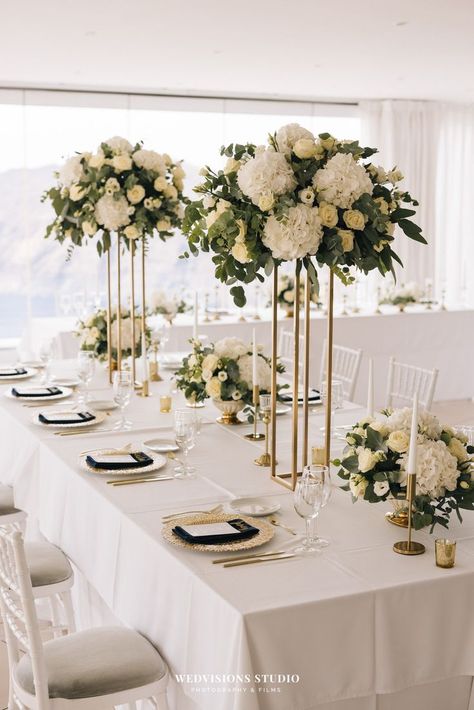 White And Gold Wedding Themes, Santorini Wedding Venue, White Wedding Decorations, Indoor Wedding Receptions, Wedding Reception Table Decorations, Tall Wedding Centerpieces, Reception Table Decorations, Gold Wedding Theme, Wedding Floral Centerpieces