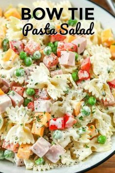 This easy bow tie pasta salad is a family favorite! Made with bow tie pasta, peas, ham and cheese, topped with a creamy homemade mayo dressing. It's the perfect potluck, or barbecue dish and a super tasty lunch! #spendwithpennies #bowtiepastasalad #pastasalad #barbecue #sidedish Creamy Bow Tie Pasta, Pasta Salad With Mayo, Bow Tie Pasta Salad, Mayo Pasta Salad Recipes, Pasta Peas, Bow Tie Pasta Recipe, Bowtie Pasta Salad, Feta Pasta Salad, Bow Tie Pasta