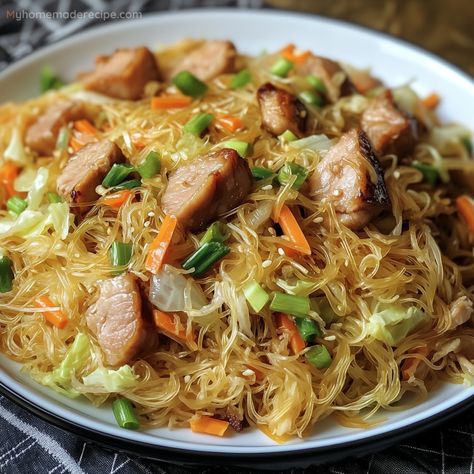 This Filipino Pancit with Beef is a savory and satisfying noodle stir-fry, packed with tender beef and vegetables for a delicious and quick meal. Filipino Pancit With Beef, Filipino Noodles Pancit Recipe, Filipino Noodle Recipes, Rice Noodle Stir Fry Recipes, Easy Pancit Recipe, Chicken Pancit Recipe Filipino, Best Pancit Recipe Filipino, Pansit Guisado Filipino Recipes, Authentic Pancit Recipe Filipino