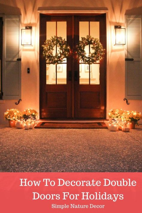 Decorate Your Double Front Doors For The Holiday. #wreathideas #frontdoors #holidaywreath Christmas Wreath For Double Front Door, Double Doors With Wreaths, Double Front Door Fall Decor Ideas, Fall Decor Ideas For The Porch Front Double Doors, Wreaths On Double Doors, Hanging Wreaths On Double Doors, Christmas Wreaths Double Doors, Christmas Wreaths For Double Front Door, Double Front Door Wreath Ideas