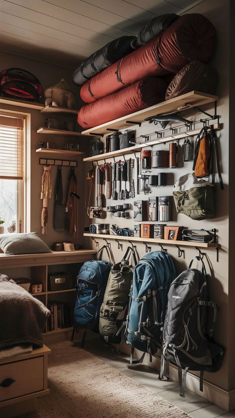 A small room with a well-organized camping gear wall, featuring neatly arranged outdoor gear on shelves and hooks. Camping Gear Wall, Camping Gear Organization, Gear Closet, Camping Gear Storage, Mobile Sauna, Outdoor Gear Storage, Gear Organization, Adventure Room, Closet Idea