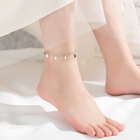 Add a touch of bohemian charm to your jewelry collection with this beautiful anklet from The Silver Luna. Crafted from high-quality 925 sterling silver, this double layer bracelet features a unique bell charms design that is sure to catch the eye. The anklet is perfect for everyday wear or for adding a touch of elegance to your outfit. The bracelet is nickel-free and features a spring ring closure for a secure fit. The silver color of the bracelet complements any outfit, while the bohemian theme adds a touch of personality. Whether you're looking for a unique piece of jewelry or a thoughtful gift, this anklet is sure to impress. Materials: 925 sterling silver Finish: platinum plate Anklet length: 8 in + 1.25 in adjustable chain. Leg Jewelry, Beautiful Anklet, Sterling Silver Anklet, Beads Chain, Silver Anklets, Foot Jewelry, Double Chain, Women Legs, Ankle Bracelet