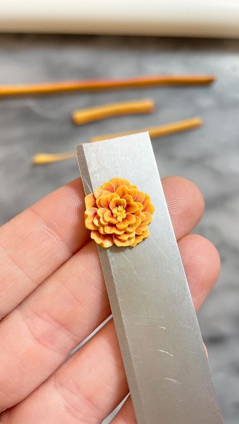 Erin Ellerker | I’m feeding the content machine 😅 Sunny days call for vibrant colours so I’m making some marigolds. | Instagram Ceramic Bead Jewelry, Homemade Clay, Clay Canes, Polymer Clay Cane, Clay Stuff, Marigold Flower, Polymer Clay Canes, Clay Inspiration, Polymer Crafts