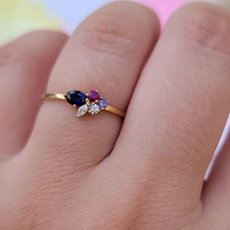 "14k Solid Gold Diamond and Gemstone Ring, Minimalist Cluster Gemstone Ring, Dainty Birthstone Band, Ruby Ring, Custom Gemstone Ring Mom  Ring Features:  * Made to Order. * Made in NYC.  * Gold: Solid 14K ( Also available in18K ) * Width of band: 1.3mm * Choice of Gold: Yellow Gold, White Gold, Rose Gold, or Platinum * Gem Stone: Blue Sapphire & Ruby & Amethyst , Mined  Diamonds  * Oval Blue Sapphire :4mmx 2.8mm * Round Ruby : 2mm * Round Amethyst:2.2mm * Round Genuine Diamond 2mm * Genuine Marq Unique Birthstone Rings, 2 Birthstone Ring, Two Birthstone Ring, Push Ring, Ruby Cluster Ring, Dainty Cluster Ring, Small Gemstone Rings, Dainty Diamond Birthstone Ring With Gemstone, Dainty Ruby Ring As Birthstone