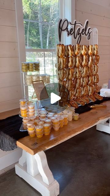 Stacy Ancel on Instagram: "I cannot say enough about Philly Pretzel Factory in Ballwin MO.  Friday nights wedding couple chose pretzels & individual dips for their cocktail hour. There are so many sweet & savory pretzel dip options. I’m always confident that when I pickup Philly Pretzels, they’ll be SUPER freshly baked and delicious. They stay fresh and tasty soft for hours. Guest absolutely love them for a cocktail hour or a late night snack.  Venue: @pinehollowweddings  Pretzel Wall set-up: @tastystations  Pretzels: @phillypretzelfactory @ppfballwin (Ballwin MO location) “Pretzels” sign: @twigsandtimber  @amanda_hunnius  • • • #tastystations #pretzelwall #pretzels #pretzelday #theoffice #cocktailhour #latenightsnack #weddingcocktailhour #weddinglatenightsnack #weddingsnacks #stlbride #st Reception Snack Bar Ideas, Pretzel Late Night Snack Wedding, Snack Table At Wedding Receptions, Soft Pretzel Cocktail Hour, Pretzel Display Wedding, Pretzels At Wedding, Late Night Snack Bar Wedding, Cocktail Hour Wedding Food Bar Ideas, Pre Reception Snacks Food Ideas