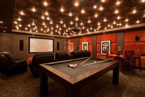 Warm, Inviting Home Theater and Game Room | HGTV Theater Room Couch, Home Game Room Ideas, Garage Games, Games Room Ideas, Theater Game Room, Video Game Room Ideas, Media Room Ideas, Garage Game Rooms, Basement Home Theater