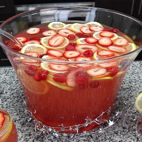 BADASS NEW YEAR'S CHAMPAGNE PUNCH 1 Bottle Coconut Rum 1 Bottle Peach Schnapps 1 Bottle Strawberry vodka 2 Bottles Rosé Champagne 2 Bottles Pink Lemonade Raspberries Strawberries Lemon Slices PREPARATION 1. Place fruits in a large pitcher and add liqueurs and mixers. 2. Serve in glasses and garnish with a strawberry. DRINK RESPONSIBLY! Pink Jungle Juice, Nye Drinks, Drink Image, Drinking Board, Jungle Juice Recipe, New Years Eve Drinks, Rosé Champagne, Strawberry Drink, Alcoholic Punch Recipes