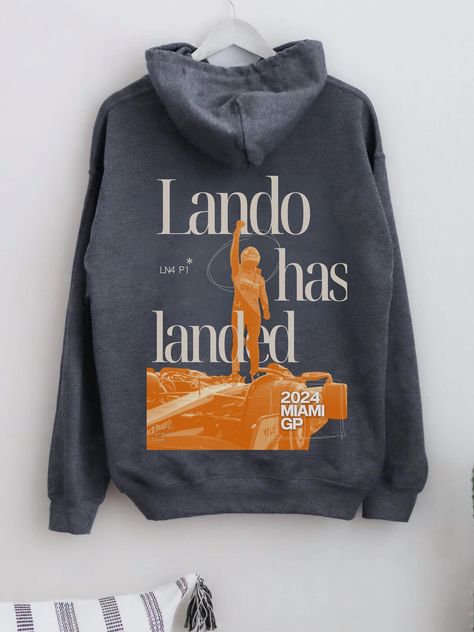 Celebrate Lando Norris's incredible P1 win at the Miami GP with the "Lando Has Landed" Hoodie. Perfect for any Formula One fan, this hoodie is all about showing your support for Lando and McLaren in style. Crafted for comfort and durability, it's ideal for race days, casual outings, or just relaxing at home. Made from ethically sourced US cotton and polyester, and dyed with eco-friendly colours, this hoodie is both stylish and sustainable. Whether you're a die-hard F1 fan or just love motorsport Lando Norris Hoodie, Formula One Merch, Mclaren Hoodie, Mclaren Outfit, Mclaren Merch, F1 Clothes, F1 Clothing, F1 Hoodie, Miami Gp