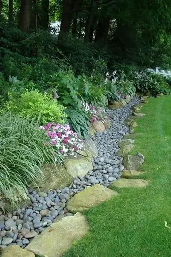 17 Hillside Landscaping Ideas to Beautify Your Hillside Yard in 2023 Dry Riverbed Landscaping, Sloped Backyard Landscaping, Landscaping A Slope, Landscaping On A Hill, Sloped Yard, Hillside Garden, Sloped Backyard, Hillside Landscaping, Garden On A Hill