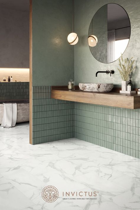 Love the scandi or Japandi style? This sage green bathroom with wooden countertop, natural stone bathtub and marble flooring offers the both of both worlds. The marble flooring look stunning and feel incredibly comfortable to walk on barefoot. Moreover, these vinyl flooring tiles are 100% waterproof and easy to maintain. Minimalism never looked cosier! #marblebathroom #minimalistbathroom #luxuryvinyltiles #flooringideas Japandi Style Interior Design, Japandi Bathroom Design, Design Interior Baie, Makeover Kamar Mandi, Japandi Bathroom, Green Tiles, Japandi Interior, Decor Baie, Bathroom Design Inspiration