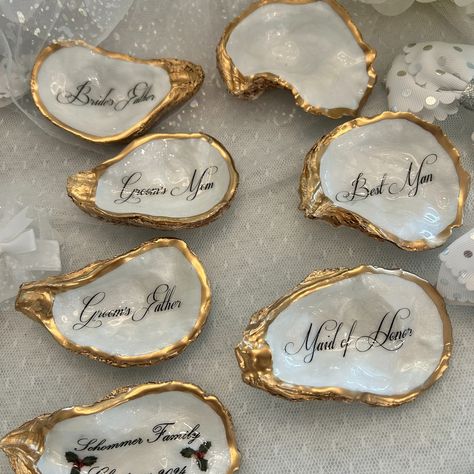 Oyster Shell Place Cards, Wedding Place Cards, Oyster Place Cards, Oyster Wedding Favor, Wedding Place cards, Wedding Decor, Pearl Wedding Handmade gifts for all of life’s special occasions. Shop on our Etsy link below https://www.etsy.com/shop/tidesoftimedesigns Custom Oyster Shell Mother of The Bride with Wedding Date - Thoughtful Gift for the Moms - Mother of the Groom - Step Mom, bridesmaids, bridal party, wedding rehearsal dinner guests, and more. ❤️Thank you for looking and hope we... Shell Name Places, Wedding Oyster Shells, Oyster Place Cards Weddings, Oyster Themed Party, Oyster Wedding Decor, Oyster Name Cards, Oyster Shell Place Cards, Oyster Wedding, Shell Place Cards