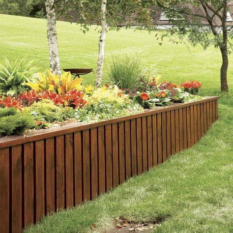 Instead of using stone or timbers, make an attractive, long-lasting retaining wall from pressure-treated 2x4s, plywood and trim boards. Construction is fast Retaining Wall Ideas, Retaining Wall Steps, Wood Retaining Wall, Diy Retaining Wall, Building A Retaining Wall, Garden Retaining Wall, Backyard Swings, Landscaping Retaining Walls, Building A Pergola