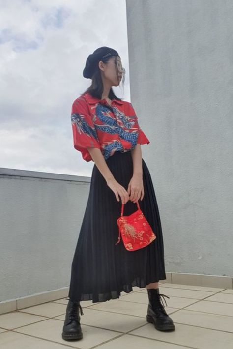 Look cool and edgy this Chinese New year with these outfit ideas! Long Skirt Dr Martens Outfit, Boot And Long Skirt Outfits, Red Top With Black Skirt, Long Black Skirt And Boots Outfit, Chinese New Years Outfit, Boots Long Skirt Outfit, Dr Martens Red Boots Outfit, Chinese New Year Outfit Casual, Chinese Skirt Outfit