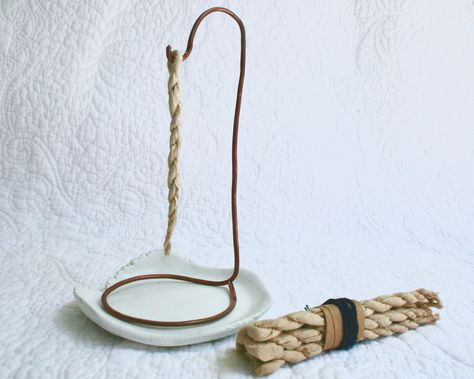 This product: Often used to help focus during meditation or to purify the home, burning rope incense is a powerful instrument in the grieving process. Use the burning time for quiet focus, journaling, rest, or another activity. Over time, the scent and ritual of lighting your incense will create a strong association with self-care. The hammered copper incense hook and cold porcelain dish have been lovingly designed to invoke notions of strength, elegance, balance, and peace.  This fairly traded Rope Incense, Meditation Spirituality, Porcelain Dish, The Burning, Hammered Copper, Cold Porcelain, Himalayan, Incense, Ritual