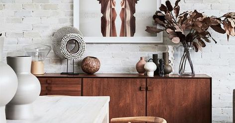 As well as incorporating extra storage, a sideboard, buffet or console also provides an opportunity to style up a storm. Here are 10 ideas to inspire you to decorate your sideboard and turn it into a talking point. Sideboard Styles, Sideboard Modern, Sideboard Decor, Cool Bookshelves, Rustic Home Interiors, Coastal Aesthetic, Exposed Brick Walls, Modern Beach House, Tv Sideboard