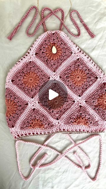 Lizzie on Instagram: "🌸🌺Adding the finishing touches to this variation on the Sunburst Mosaic Bralette🌺🌸
.
I’ve had a few questions lately on this top so I thought I’d give you a run down on the pattern🥰
The pattern is primarily written for the V-neck Bralette version, you can see a picture of it all over my Instagram profile, and the pattern has suggestions for different configurations and stackings of the squares and triangles for different  styles! Last year, my testers all made different variations of the top, and the measurements and photos of these styles are featured in the gallery guide which is downloadable with the original pattern too! 
.
If you have any questions or want to switch it up in any way please feel free to and tag me or send me a pic of whatever variation you ha Triangle Crochet Top, Sunburst Mosaic, Crochet Triangle Top, Crochet Sunburst, Triangle Crochet, Crochet Triangle, Triangle Top, A Pic, The Gallery