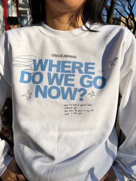 Gracie Abrams: Where do we go now? inspired sweatshirt, original design with lyrics and drawings Crewneck sweatshirt material is 50/50 cotton and polyester. Each item is uniquely printed and designed by me. Black/Blue ink on White Clothing Unisex Sizing (S,M,L,XL) *Message for XXL sizing! Wash instructions: Turn inside out, wash with cold water and delicate setting. Air dry preferred. *Follow specific care instructions to ensure the longevity of the design for all handmade items. Check out my In Gracie Abrams Shirt, Where Do We Go Now, Good Riddance Tour, Merch Shirt, White Clothing, Good Riddance, Crewneck Design, Concert Fits, Gracie Abrams