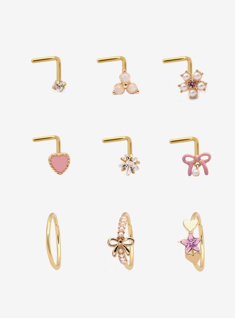 Gold-tone set including 6 nose studs and 3 nose hoops with pink heart  bow  star and flower designs. Plus  opalescent  faux pearl and pink gem detailing.Jewelry care: Wash with antibacterial soap and warm water.Piercing care:� Wash hands thoroughly  then clean piercing with H2Ocean (sold separately) or saline solution.316L surgical steel Nickel-free2mm - 7.5mm designsSet of 9Use in healed piercings only. Remove immediately if irritation occurs. Do not use harsh or alcohol-based che Bow Nose Piercing, Cute Nose Jewelry, Cute Nose Piercing Jewelry, Faith Piercing, Cute Piercings Nose, Pink Piercings, Cute Nose Studs, Heart Nose Stud, Gold Nose Piercing