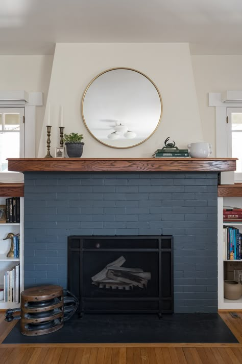 Painted brick fireplace Grey Blue Fireplace, Navy Fireplace Brick, Light Blue Brick Fireplace, Dark Blue Brick Fireplace, Painted Fireplace Bricks, Navy Blue Brick Fireplace, Red Brick Fireplace Makeover Ideas, 90s Fireplace Makeover Before And After, Colored Brick Fireplace