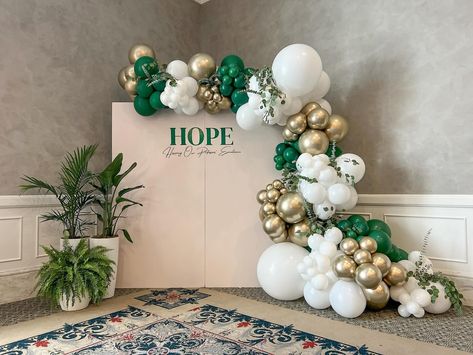 Bringing the beauty of nature indoors with our stunning and elegant balloon garland in gold, white, and green, accented with fresh greenery and eucalyptus! 🎈🌿✨ Green White Gold Balloon Garland, Green And White Backdrop, Green And White Balloon Arch, Green Balloon Garland, Moms' Night Out, Moms Night, Green Balloon, Balloon Display, White Balloons