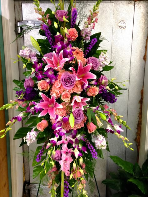 Funeral Standing Spray with pinks and violets focal flowers being pink roses and stargazer lilies. Focal Flowers, Standing Spray, Sympathy Floral, Casket Flowers, Pink Flower Arrangements, Grave Flowers, Large Flower Arrangements, Memorial Flowers, Cemetery Flowers