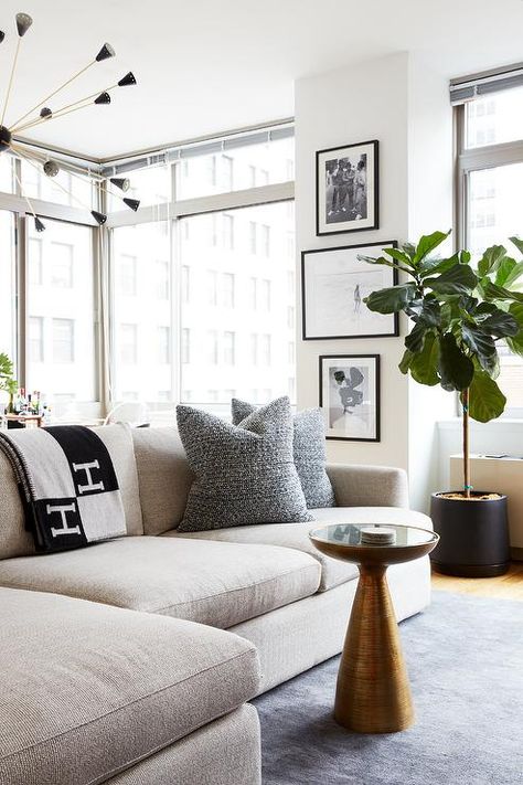 Cozy high rise living room is furnished with a mushroom linen sectional draped in an Hermes Avalon Blanket and topped with black pillows. Hermes Blanket, Linen Sectional, Jute Rug Living Room, Black Living Room, Black Pillows, Linen Sofa, Room Interior Design, Pictures Ideas, Contemporary Living Room