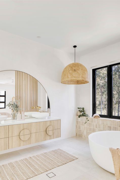 Breezy Mediterranean-inspired Queensland home, Casa Blanca Modern Mediterranean Laundry Room, Arch Mirror In Bathroom, Round Bathtub Ideas, House On Acreage, Pendants In Bathroom, Pendant Over Bathtub, Timber Vanity Bathroom, Bathroom With Closet, Mediterranean House Interior Design