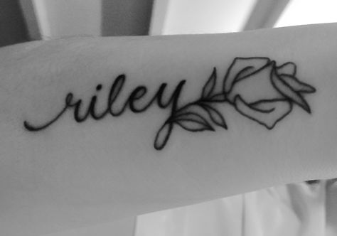 Riley Rose tattoo Rose Cursive Tattoo, Riley Name Tattoo, Simple Rose Tattoo With Name, Rose With Name Stem Tattoo, Name Inside Rose Tattoo, Miley Tattoos, Riley Tattoo, Riley Name, James Tattoo