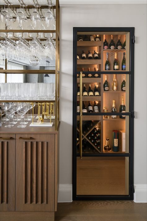 Captivating wine room with elegant crittall glass doors, softly illuminated ambiance, and a glimpse of our custom-built bar featuring suspended glass storage and subtle undercounter fridge drawers. 🍷🍇 #WineRoomGoals #HomeBar InteriorDesign #wineroom #winecellar #barinspo #homebar #entertainmentroom #winestorage #crittalldoor Built In Bar Cabinet, Undercounter Fridge, Glass Fridge, Cabinet Glass Doors, Fridge Drawers, White Cupboards, Bar Unit, Built In Bar, Sideboard Bar