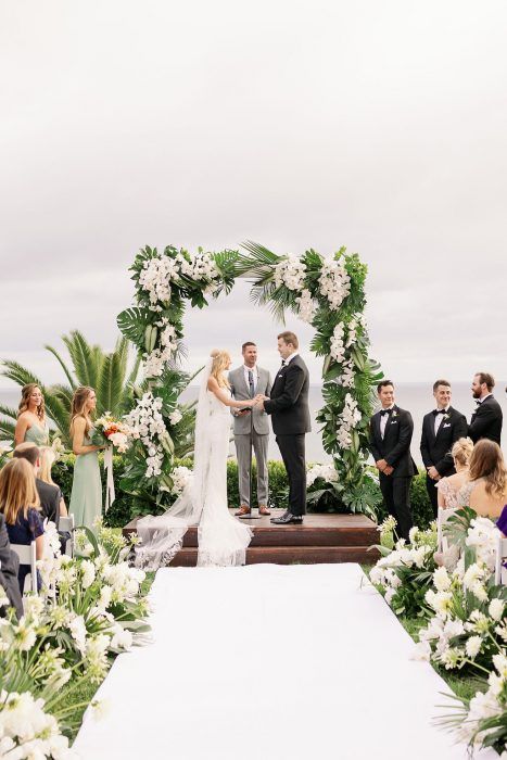 AN INTERTWINED EVENT: TROPICAL PARADISE AT BEL AIR BAY CLUB | Intertwined Weddings & Events Diy Fake Flower Wedding Arch, Palm Wedding Arch, Green And White Tropical Wedding, Tropical Chuppah, Tropical Rustic Wedding, Tropical Wedding Arch, Venue Aesthetic, Elegant Tropical Wedding, Pelican Hill Resort