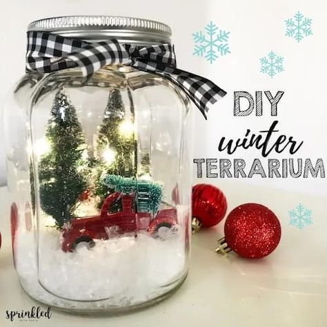 In this tutorial, I'm sharing how to make an easy, retro farmhouse-inspired light up winter terrarium that will be perfect for your Christmas decor. Winter Terrarium, Christmas Jars Decorations, Mason Jar Christmas Decorations, Fairy Lights In A Jar, Christmas Fairy Garden, Mason Jar Christmas Crafts, Jar Projects, Jars Ideas, Christmas Workshop