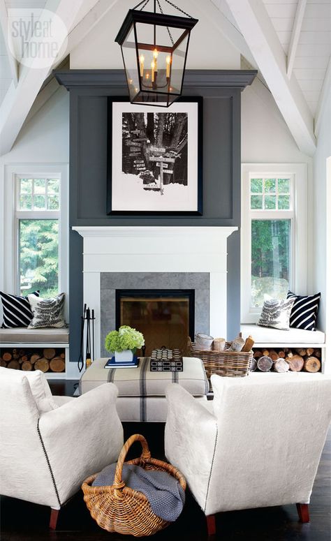 In the living room, a striking fireplace with a towering chimney breast and an oversized lantern-style pendant light are simple yet equally dramatic features. Real Estat, Modern Cottage, Fireplace Makeover, Fireplace Ideas, Fireplace Wall, Fireplace Design, Style At Home, Family Rooms, Design Case