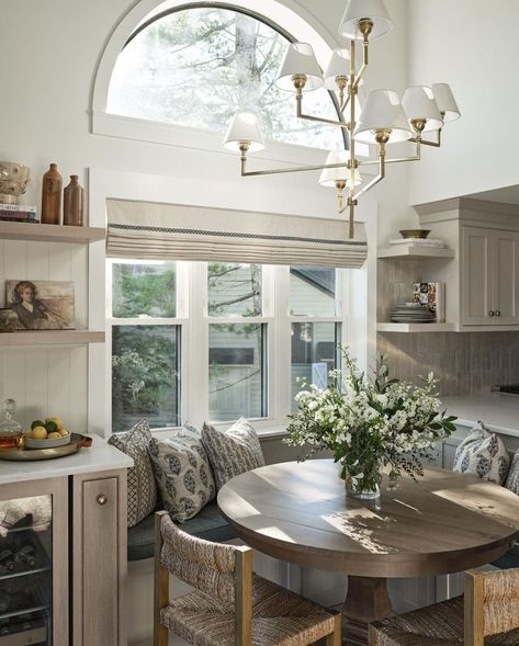 Breakfast Nook design by Teaselwood Design | There is nothing cozier than this charming breakfast nook from @teaselwooddesign ☕️🥞 this sunny corner is sure to brighten any morning! Oak Breakfast Nook, Breakfast Nook With Round Table, Wood Breakfast Nook Table, Breakfast Nook Corner Window, Kitchen Layout With Breakfast Nook, Breakfast Corner Kitchen, Nook Kitchen Table, Corner Breakfast Nook With Shelves, Breakfast Nook Cottagecore