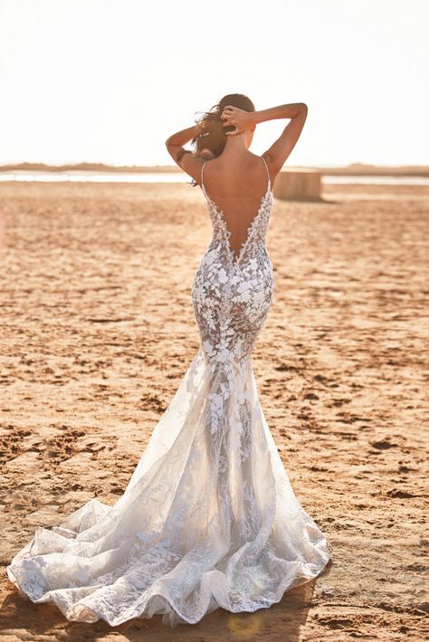 Feminine semi-transparent, lace-appliques wedding dress in white. Features a plunging V-neck, open back, long sheer tulle train and a beige lining. Haute Couture, Milla Nova Wedding Dresses, Vestidos Boho, Bohemian Style Wedding Dresses, Milla Nova, Destination Wedding Dress, Fancy Wedding Dresses, Back Wedding Dress, Applique Wedding Dress