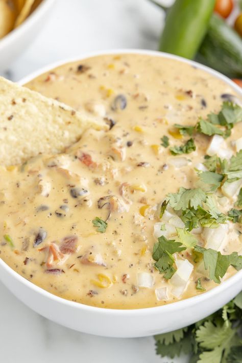 This recipe for Cowboy Queso is different from your average cheese dip. It has tasty mix-ins like sausage and beans. Make this creamy Velveeta queso for your next party, and it will surely please even the pickiest eaters! Cowboy Queso, Best Queso Recipe, Sausage Queso Dip, Queso Dip Velveeta, Sausage And Beans, Sausage Queso, Sausage Beans, Velveeta Queso, Cheese Spreads