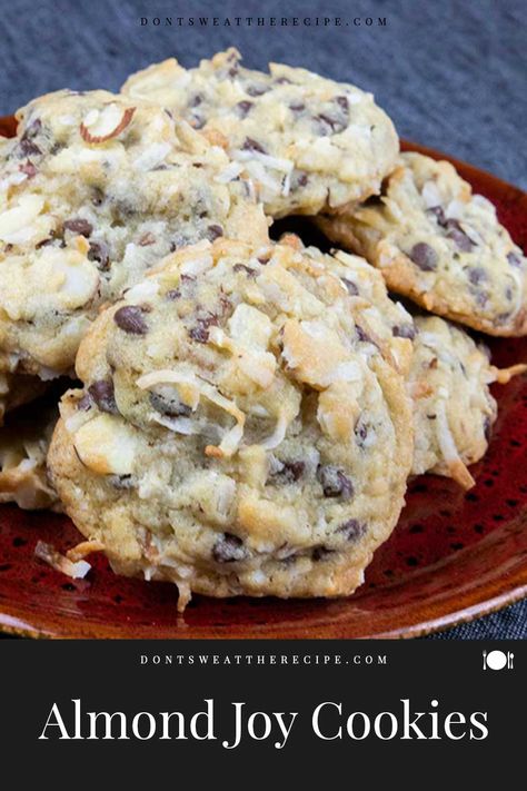 Almond Joy cookies are a blend of sweet coconut, semi-sweet chocolate chips, and sliced almonds. A delicious twist on your favorite candy bar! Almond Joy Chocolate Chip Cookies, Desserts With Sliced Almonds, Almond Joy Cookies Best, Recipes With Sliced Almonds, Desserts With Almonds, Almond Joy Cookies Recipe, Candy Bar Cookies Recipes, Recipe For Almond Joy Cookies, Sliced Almond Cookies