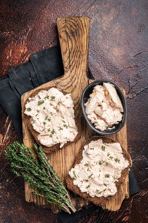 Cod Liver open Sandwich on wooden board. Dark background. Top view stock photography Cod Liver, Food Advertising, Sea Bass, Top View, Wooden Board, Dark Backgrounds, Stock Photography, Seafood, Sandwiches