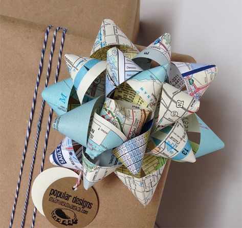 Gift wrapped in brown paper with bow made from recycled maps Wrapping Paper Upcycle, Recycled Gift Wrapping Ideas, Art Caddy, Eco Craft, Eco Gift Wrapping, Eco Friendly Wrapping Paper, Eco Christmas, Eco Crafts, Eco Friendly Wrapping