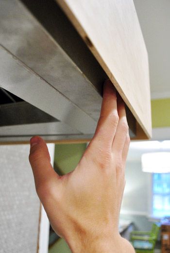 Gotcha Covered: Building A Wood Range Hood Cover | Young House Love How To Build A Range Hood, Wood Hood Cover, Wood Hood Cover Kitchen, Covered Range Hood Ideas, Cooker Hood Cover, Building A Range Hood Cover, Beadboard Range Hood, Open Shelving Around Range Hood, How To Build Range Hood Cover