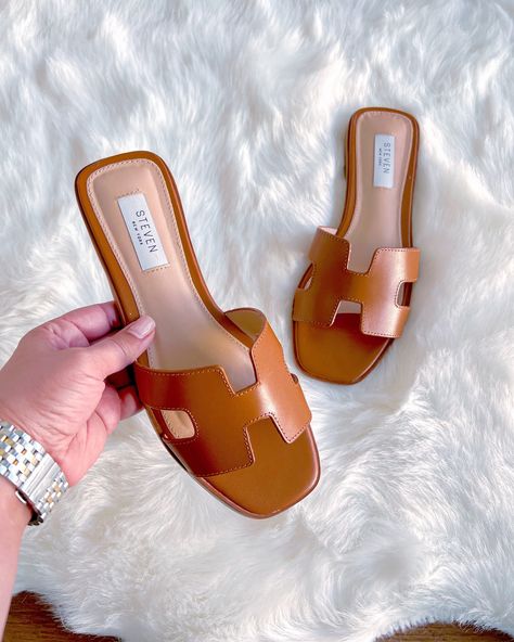 Click on the photo to shop! | Summer sandals, spring sandals, spring shoes, spring footwear, summer sandals, summer shoes, summer footwear, shoe wishlist, summer slides, flat sandals, spring slides, brown sandals, brown slides, cognac sandals, cognac slides, designer lookalike, designer inspired sandals, flip flops, cute sandals for summer, steve madden sandals, summer slides, neutral sandals, versatile sandals, summer outfits with sandals, women's style, fashion inspo Outfits With Sandals, Spring Slides, Casual Date Night Outfit Summer, Wishlist Summer, Dinner Outfits Summer, Spring Footwear, Brown Slides, Slide Sandals Outfit, Cognac Sandals